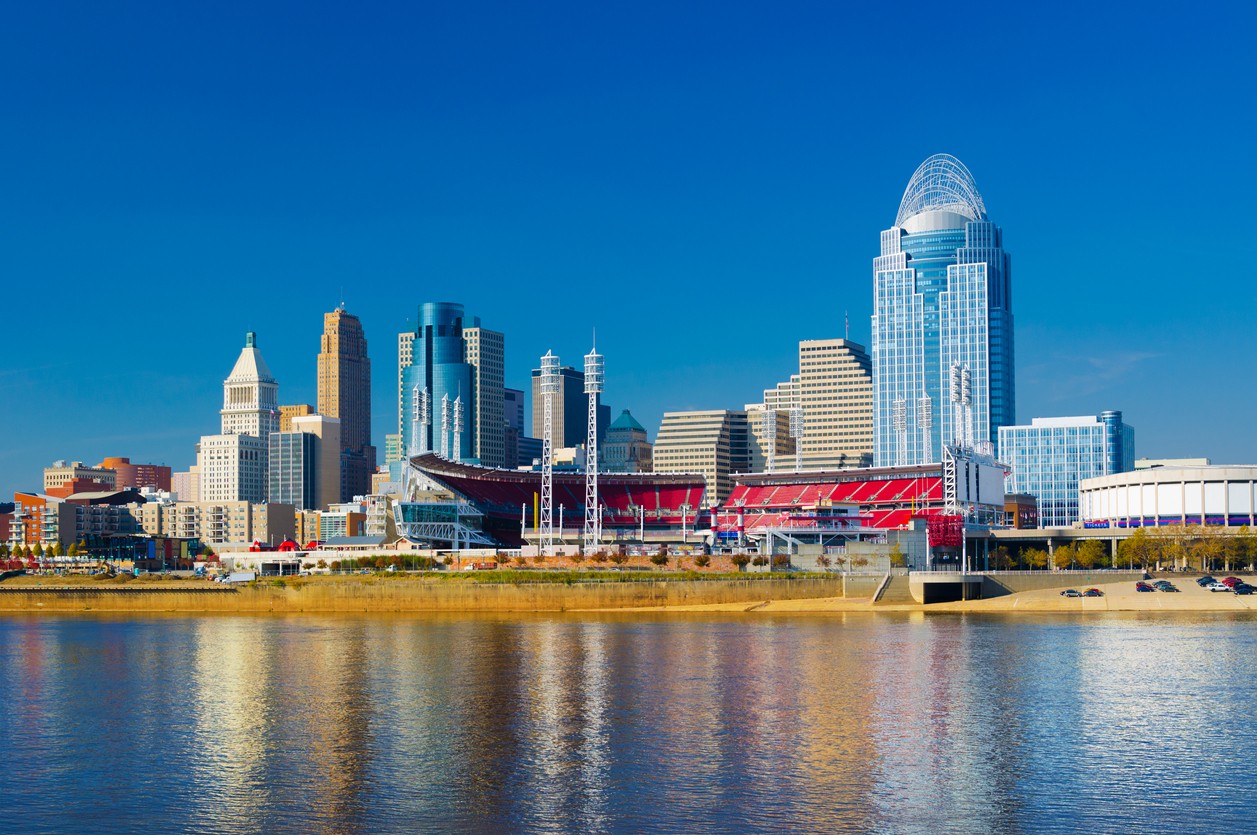 Downtown Cincinnati skyline in the background with the Great American Ball Park midway and the Ohio River in the foreground.
