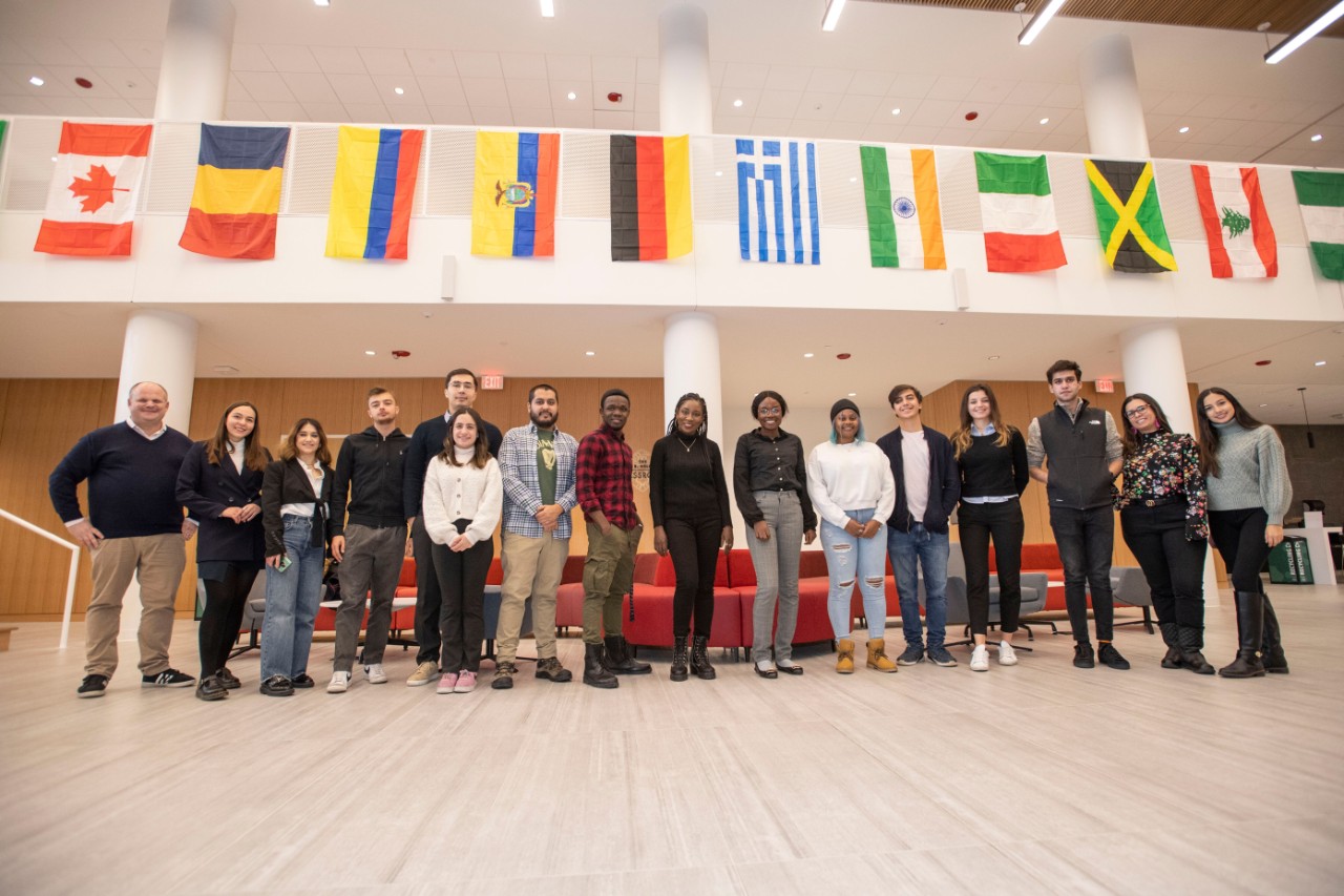 Group of LLM students surrounded by international flags